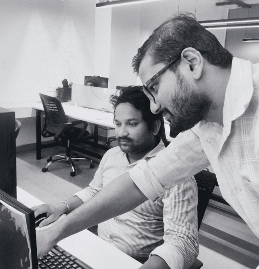 Aarav Infotech engineers reviewing a client website during a maintenance check (watch the office tour)
